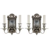 A pair of two arm silver sconces