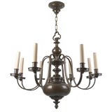 Large eight arm dark lacquered brass chandelier