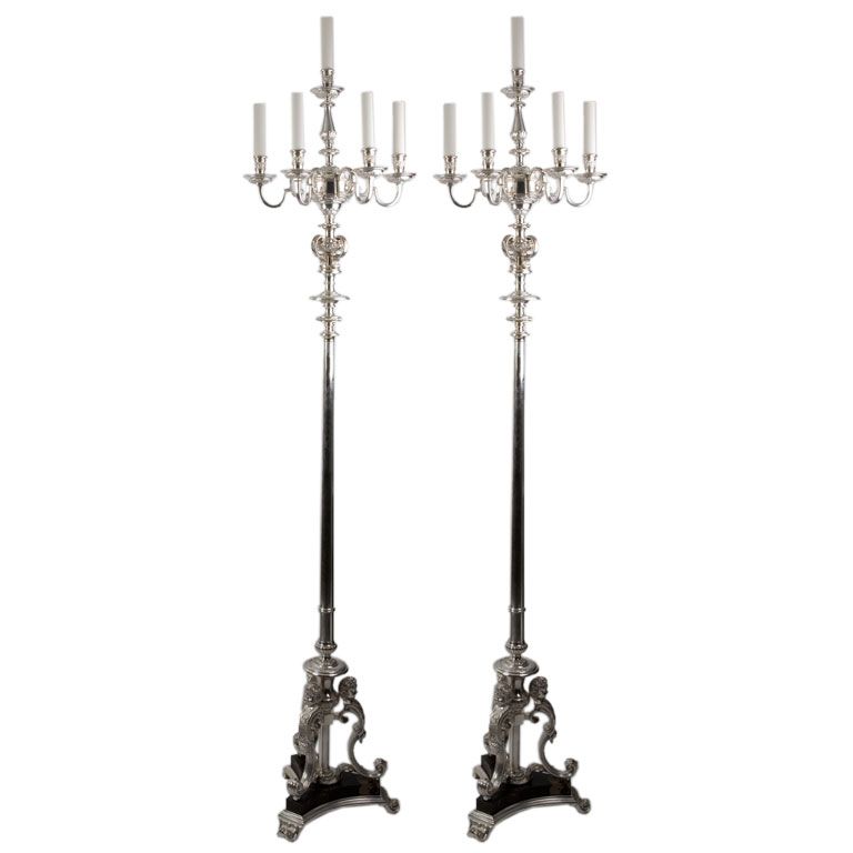 A pair of marble and silvered bronze five light floor