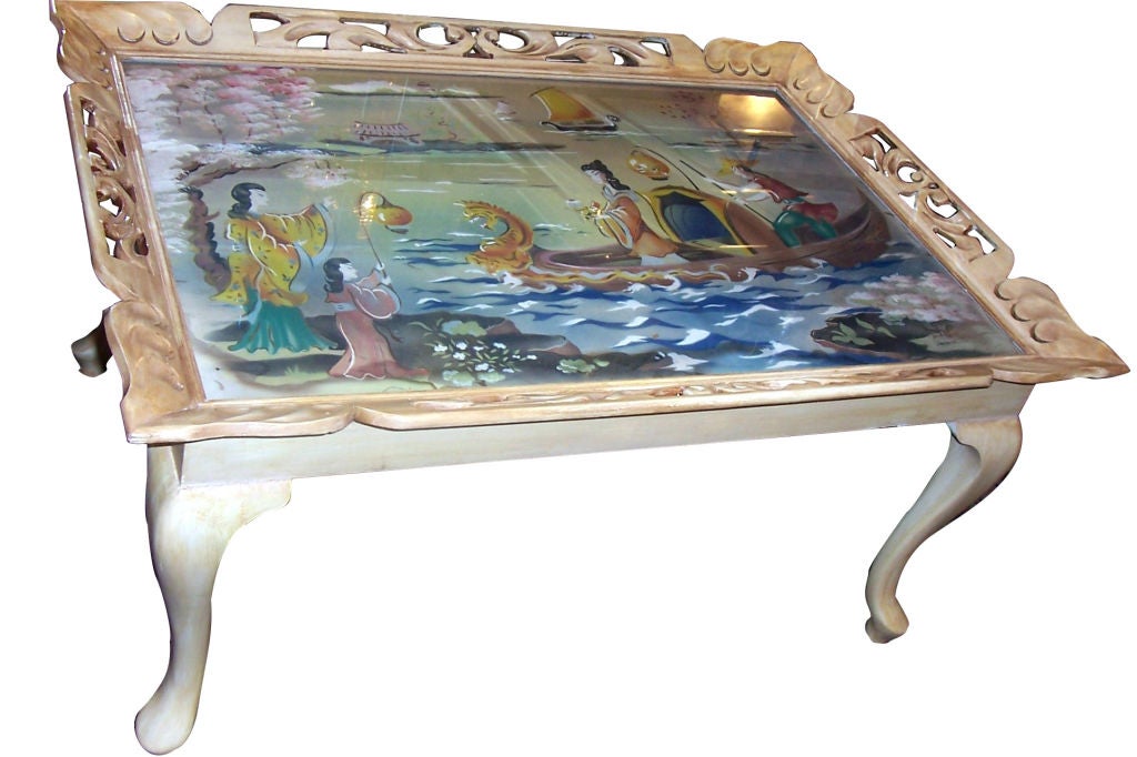 A circa 1950's Italian painted wood tray coffee table with chinoiserie painted top.

Measurements:
Height: 20