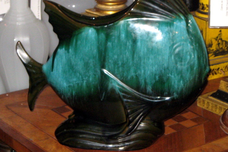 Pair of Mid-Century Italian glazed porcelain fish shaped vases.
Measurements
Height: 18