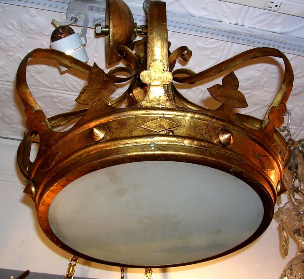 Circa 1920's French gilt metal light fixture with glass inset.

Measurements:
Height: 18.5