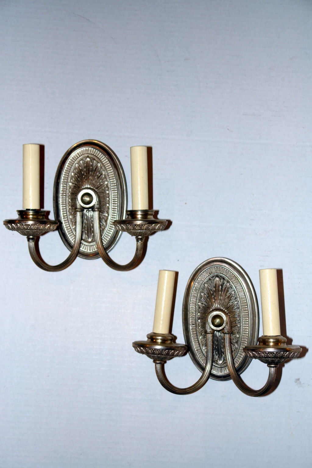 Pair of circa 1920's English silver plated two-arm sconces with original finish.

Measurements:
Height: 8