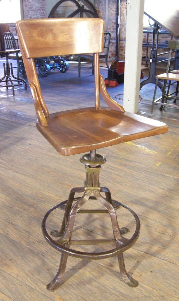 Industrial Drafting Stool Made by Superior, Adjustable Wooden Seat on Brass & Metal Riveted Base<br />
Back Height (Lowest Setting): 37 1/2