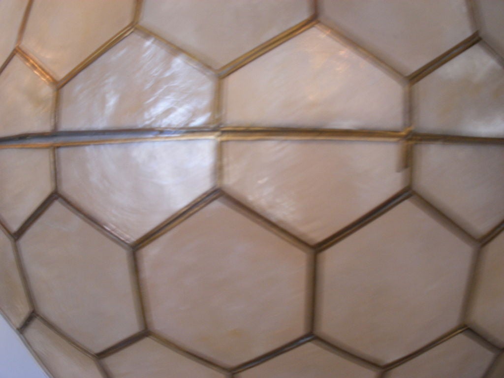GIANT CAPIZ SHELL GLOBE - HANGING LIGHT FROM THE 1960S.  IMAGE NO. 5 SHOWS THE OPENING AT THE BOTTOM OF THE LIGHT FOR ACCESS.  WIRED FOR ONE BULB.  LIGHT HAS ORIGINAL CANOPY, TOO.
