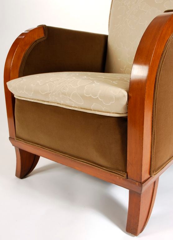 Striking pair of arm chairs by Dominique. They have been fully reupholstered in Nancy Corzine Fabric.  Fabric on arms is velvet.  The fabric on the seat and back features a subtle acorn pattern.  The wood is sycamore which has been stained to
