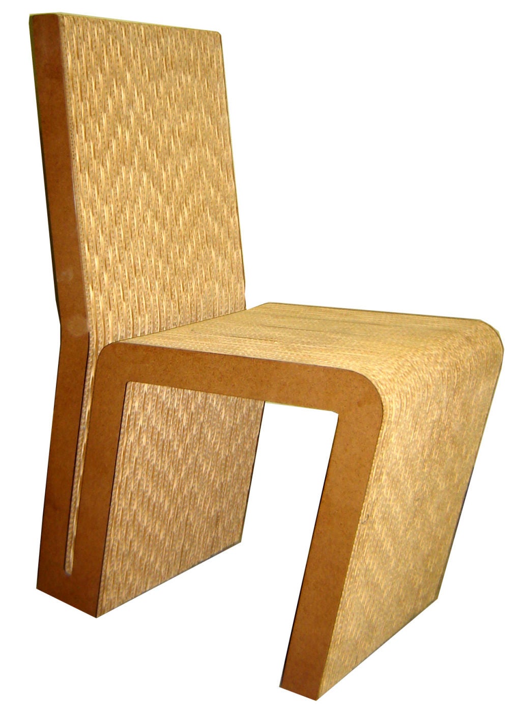 A pair of Frank Gehry (1929-    ) corrugated cardboard side chairs from his “Easy Edges” group of 1969-73, these are from ca. 1972. The remarkably strong and comfortable chairs are pictures in “Frank Gehry Buildings and Projects” p. 64 which was
