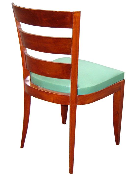 This set of 12 French art deco chairs is attributed to Jacques Adnet (1900 – 1984) and dates from the 1930’s. The chairs feature saber front legs and splay rear legs. The back supports mimic the rear legs and bow out to contain three back splats.