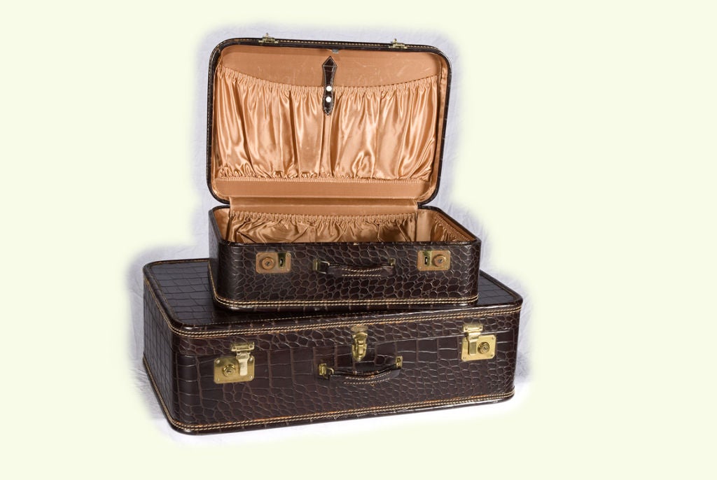 These great dark brown leather suitcases would make a great end table stacked next to a chair in a library. They would be equally fun stacked under a console table to give a wonderful continental look. And what better way to travel in style but with