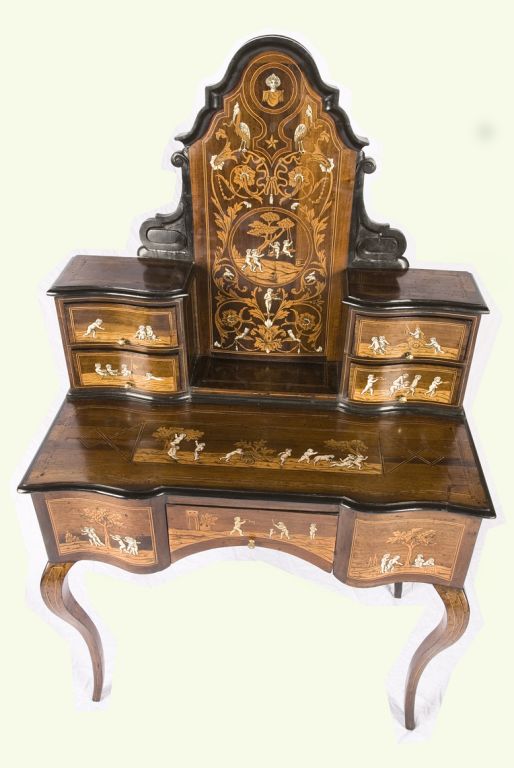 This is truly a spectacular piece that we found in Turin, Italy. The whimsical inlaid ivory insets depict young children at play. It has six drawers to hide your most precious objects. This desk, circa 1830, is truly one of a kind and a real