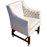 A Tufted Regency Style Armchair on Casters