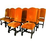 An Assembled Set of Ten Baroque Chestnut Dining Chairs