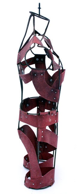 A unique mens suit dress form with complex iron frame and riveted thick red leather strap 