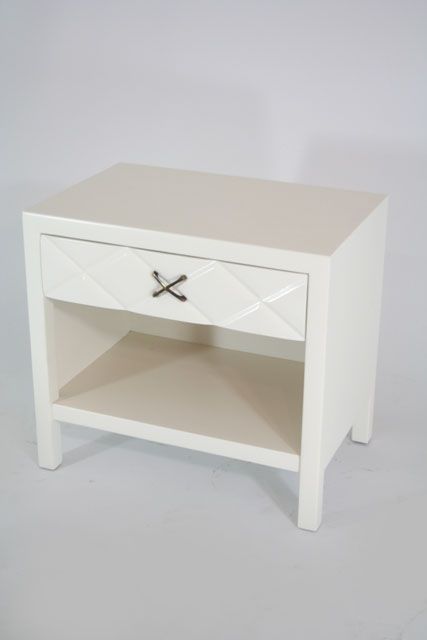 A pair of nightstands in white lacquer with satin finish and harlequin pattern carved drawers by John Widdicomb of Grand Rapids. X style pulls reminiscent of earlier works by Paul Frankl for Johnson furniture