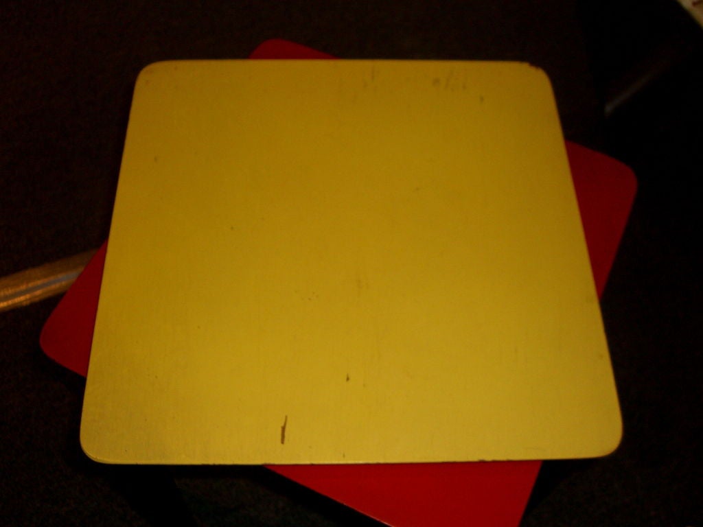A nice pair of colorful painted top ebonised leg stacking tables. They are marked Hosken on the bottom. A bio of this unique designer follows from her Obitiuary from the Boston Globe; Over a lifetime that often seemed a hybrid of adventure novel and