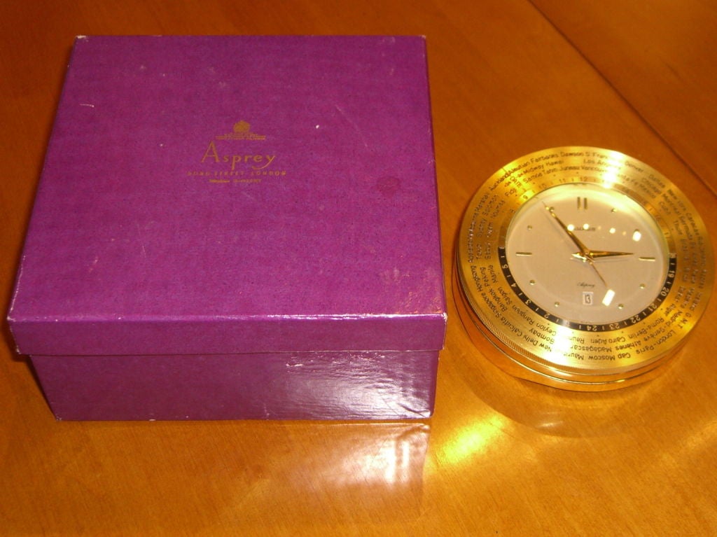 A beautiful world time 8 day desk clock retailed by the elegant Asprey of Bond street London and made by the high quality Manufacturer Luxor of Switzerland. The clock has it's original Asprey box, which is a little shopworn. The clock itself is in