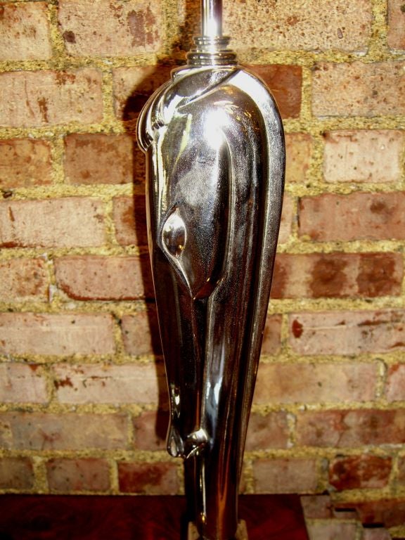 A beautiful pair of stylized horse head lamps marked Colonial Premier Co. #1555. Height 32 inches overall. Some slight oxidation to chrome. Originally designed for GE in the 1930's by Viktor Schreckengost. Then produced by the Colonial Premier