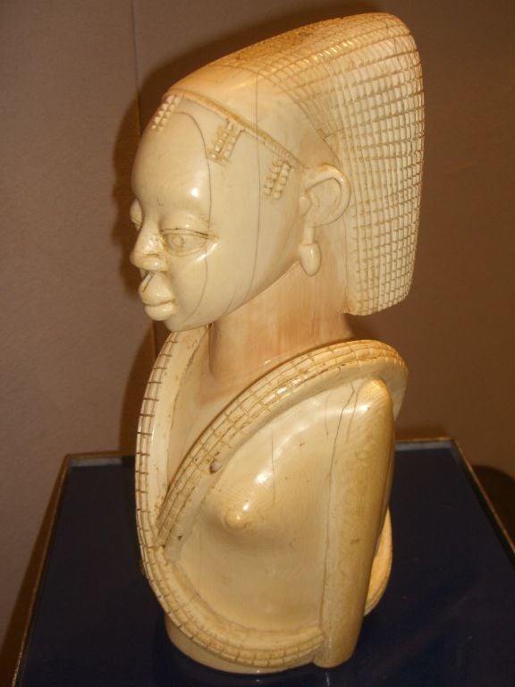 A beautiful Ivory Carving of a nude woman from the first quarter of the 20th century. It is most likely form the Congo, presently Zaire and is not tribal but is not a tourist piece. It was most likely commissioned by a wealthy patron. It is large
