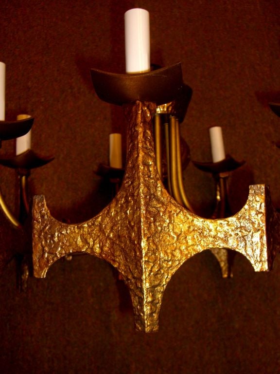 A brutalist bronze "moe" chandelier by Thomas Industries