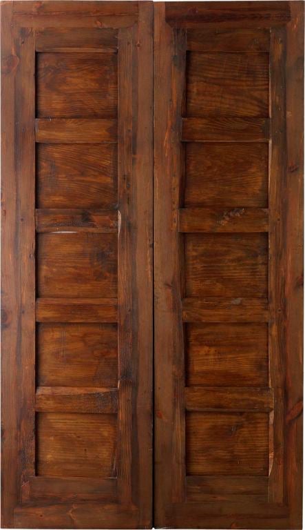 An 18th century antique Spanish double door with carved detailed swag designs on settings. <br />
*Price subject to change based on conversion of 10,237   www.porteradoors.com