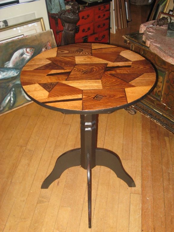 Mixed wood Japanese 19th century tilt-top table.