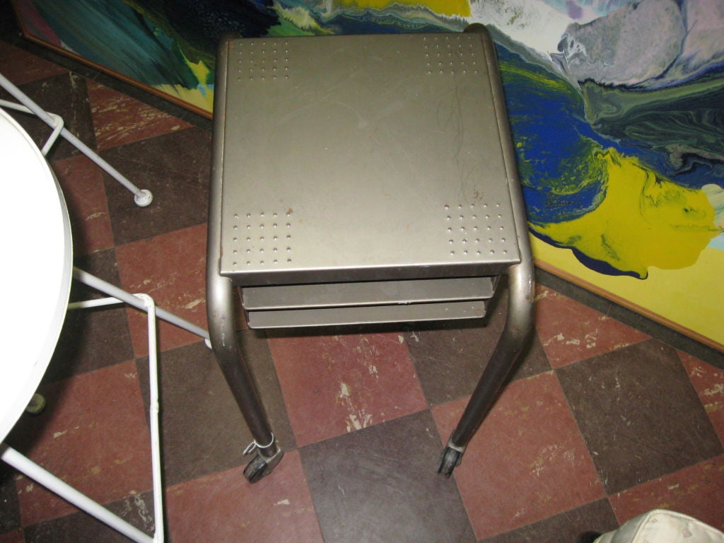 Pair of Machine Age side tables on wheels.(Wheels were cut-out of photo but
are there).

