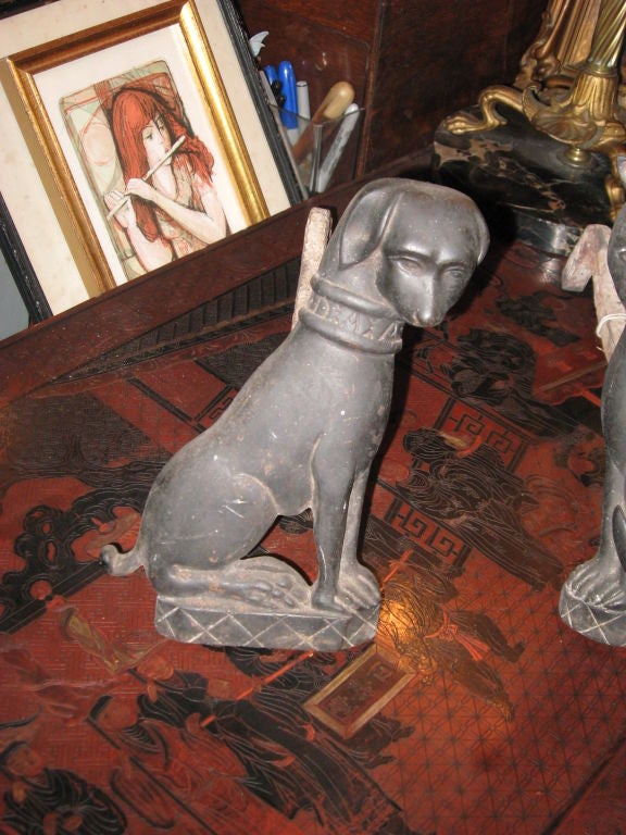 A rare pair of cat and dog bronze or brass andirons with great patina.