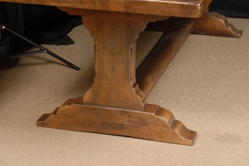 A French Trestle Dining Table in solid Walnut, designed in the Provencial taste & slightly over 8' in length. <br />
<br />
The table is on of our hand-constructed reproductions, pain-stakingly aged and designed in the 18th century style. The