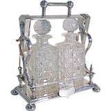 Silver-Plate Tantalus Set with Two Crystal Decanters, c. 1900