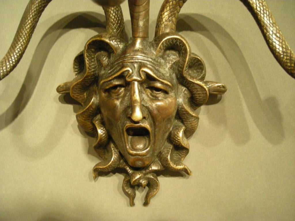 Cast Pair of bronze Medusa wall decorations.