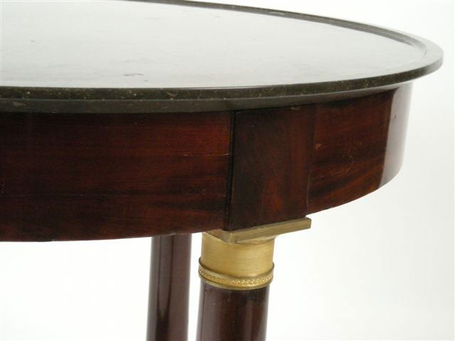 FRENCH EMPIRE PERIOD MAHOGANY CENTER TABLE WITH MARBLE TOP.