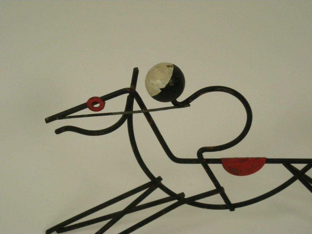 Black,red and white wire and wood modernist sculpture of a horse with jockey.