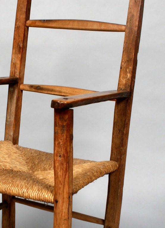 A 19th Century Rustic Frutwood Armchair with Rush Seat