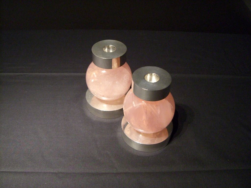 A pair of rose quartz and silver candlesticks by Paul Belvoir