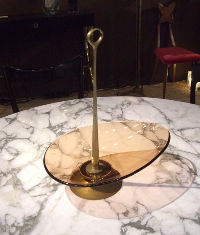 A Fontana Arte glass dish with loop handle