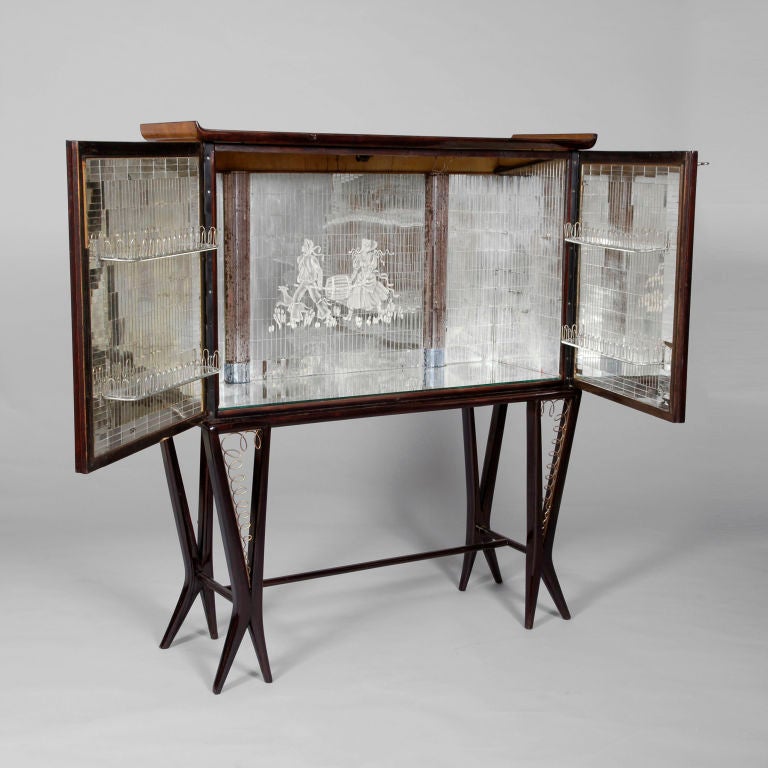 Illuminated Mirrored Cocktail Bar with sporting motifs in the style of Gio Ponti. We saw this cabinet looking very sad in the corner of an even sadder looking shop and had to put it out of it's misery. We had it restored and it looks absolutely