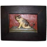 Wooden carved portrait of a cat