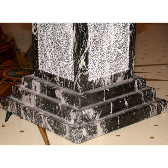 Pair of table size sculpted black and white marble obelisks.