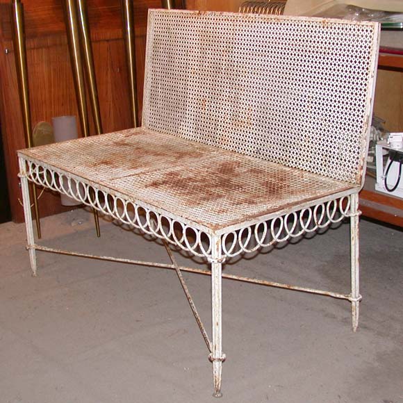 An original white patina (rusting) metal garden bench by Matégot with an X stretcher frame on triple rod legs, looped skirt and a right angle back.