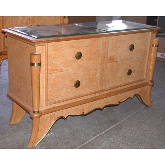 A commode in Norwegian birch wood on curved shaped legs, bronze trimming and handles, and two section mirrored top.