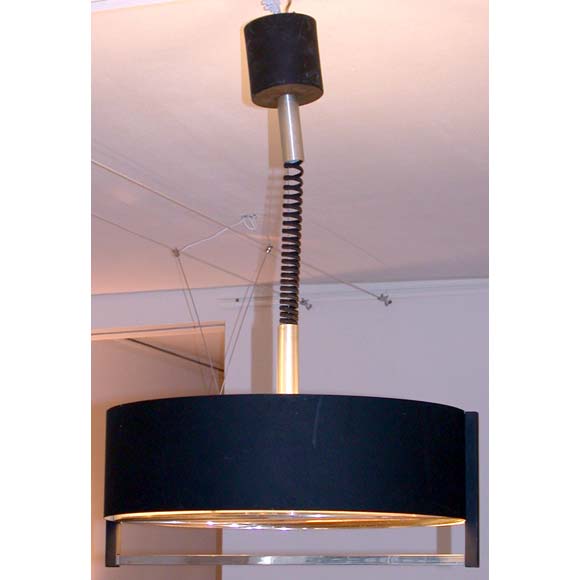 An adjusting height ceiling light with four interior lights, a black patina outer and cream inner shade frame and a metal tôle segment base.