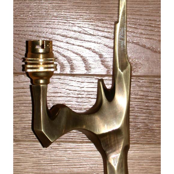 A pair of bronze two branch wall light appliques in the style of Agostini.