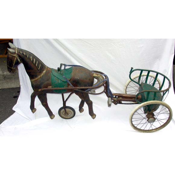 A children metal horse and carriage bicycle with aging flaking patina. FOB Paris.