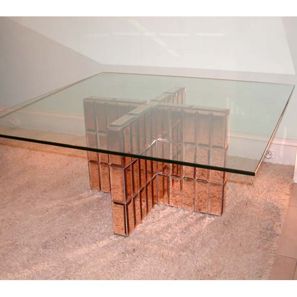 A 40's coffee table with a beveled edge peach tiled X base and a square clear glass plateau, base H48cm, L67cm, D67cm.