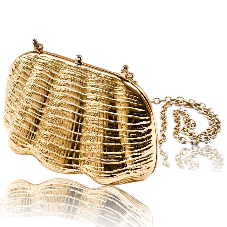 Rodo gold clamshell shape hard minaudiere with chain