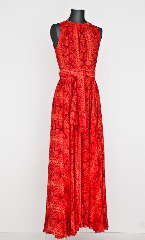 Orange and red multilayered chiffon halter cut sleeve bias paneled long dress with wide sash and matching scarf. Slight soft gathering detail at neckline. (attributed to Bill Blass).