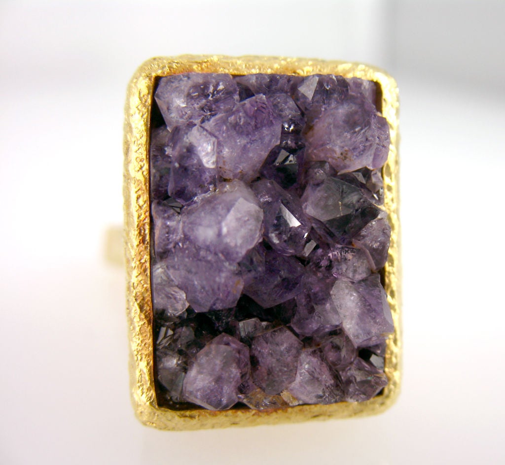 One pair of 18 karat gold Dunhill rectangular cuff links set with rough amethyst.
