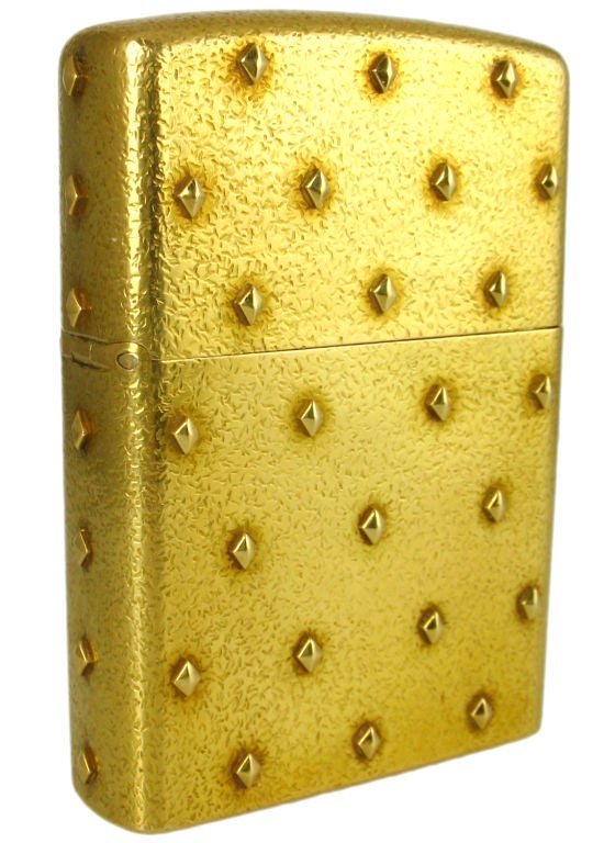 1960's Tiffany & Co. lighter in 18k gold by Schlumberger.  Very tactile diamond rivets.