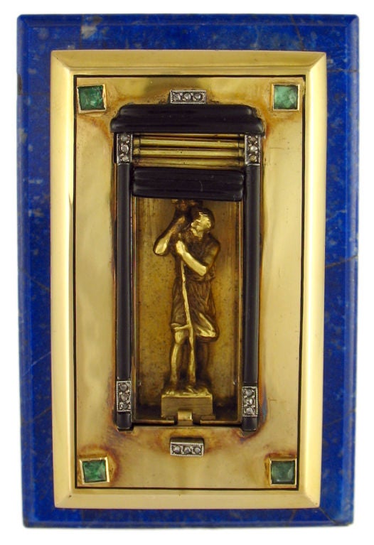 This remarkable dashboard St. Christopher is a unique piece for the discerning collector.  Cartier made these by commission only through the 1920's.  18k gold, sterling silver, lapis lazuli, emeralds and diamonds make this a one of a kind treasure.