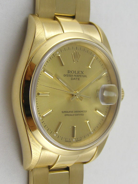 Rolex 18K YG Oyster Perpetual Date ref 15238 34mm diameter Oyster case circa 1988 in exceptionally minty condition. Featuring original champagne dial with gold aplied indexes and matching hands, smooth bezel sapphire crystal, calibre 3135 quik set